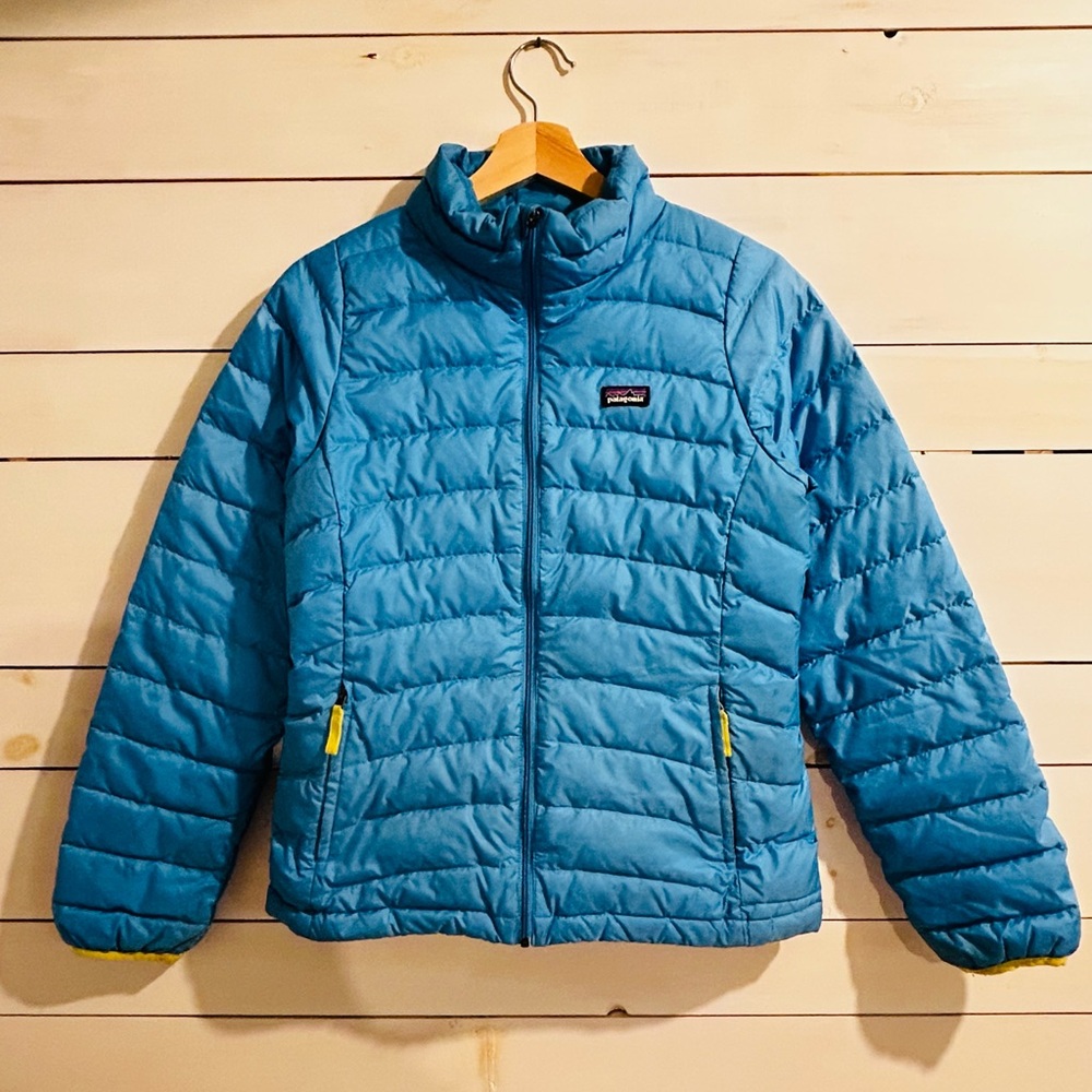 A Patagonia jacket, blue and the outside and a green/yellow on the inside